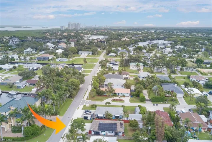 Aerial overview of property's location featuring nearby suburban area