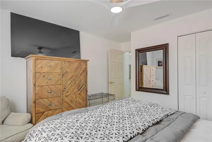 Bedroom with a closet and ceiling fan