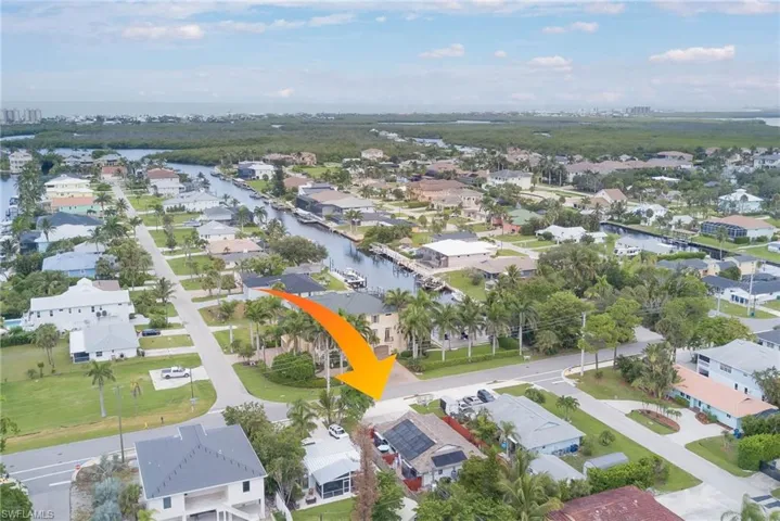 Aerial perspective of suburban area with a large body of water