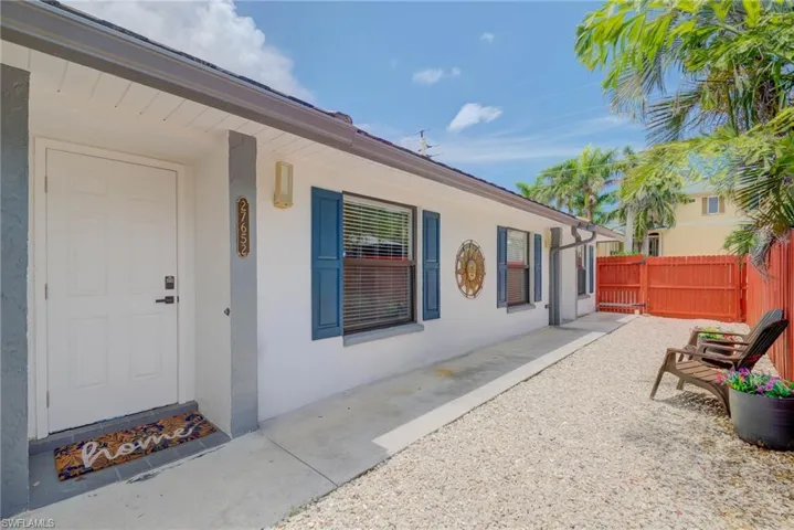 Doorway to property with stucco siding