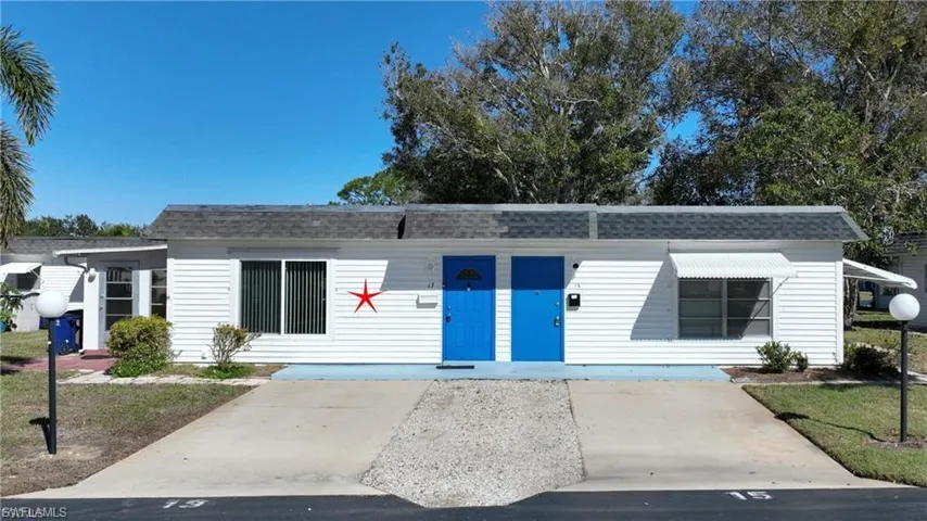 White siding exterior with blue entry doors