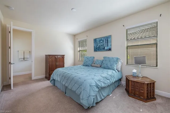 Carpeted bedroom with baseboards