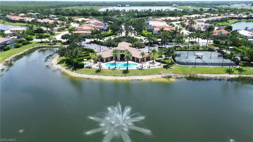 Aerial view of residential area featuring a large body of water