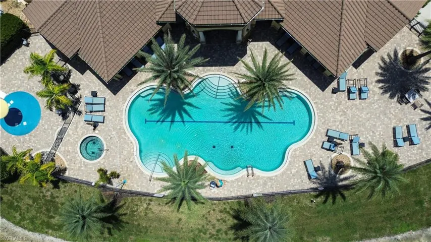 Community pool with a patio area