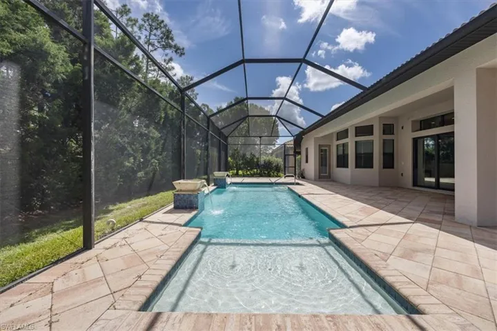 Outdoor pool featuring a patio area and a lanai