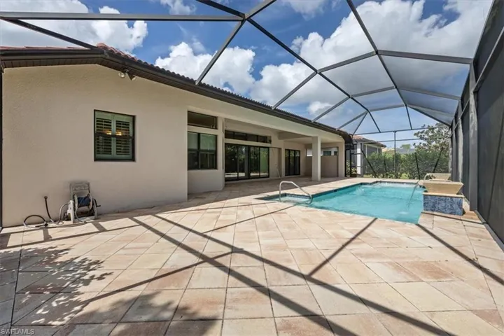 Outdoor pool featuring a patio area and a lanai