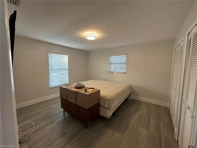 Bedroom with gray flooring and a closet