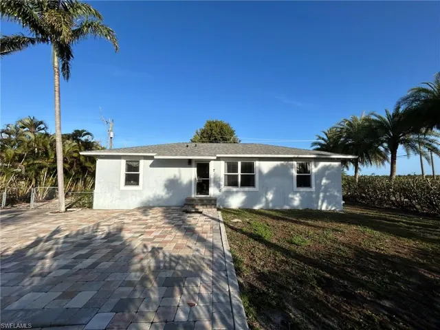 Single story home featuring stucco siding