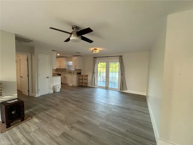 Dining Area featuring ceiling fan, light wood-style flooring, and french doors