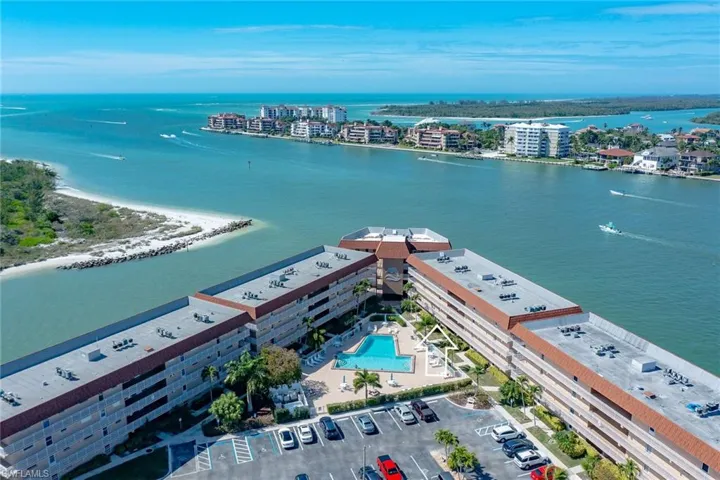 Ariel view of a nearby body of water and apartment complex