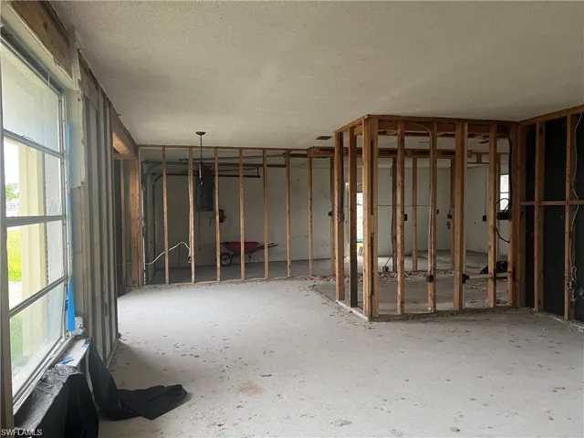 Misc room with a textured ceiling and electric panel