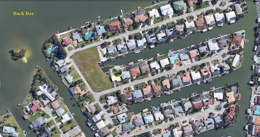 Aerial overview of property's location featuring nearby suburban area