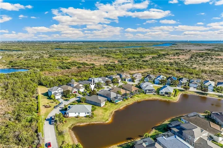 Aerial view of the community with an arrow to identify the subject property.