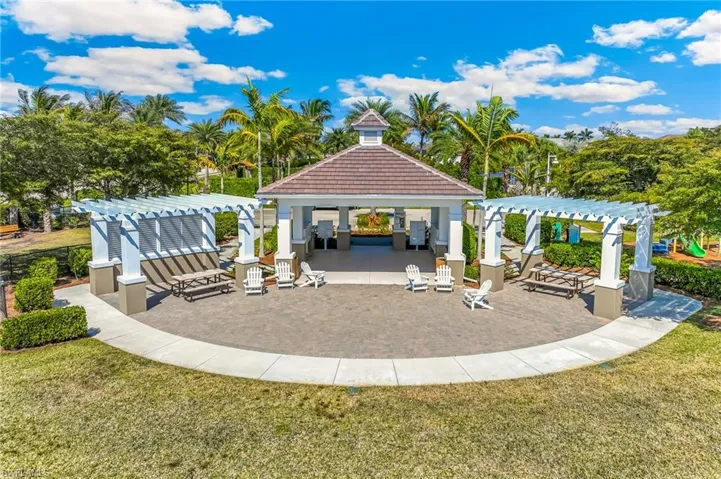 View of community terrace with a pergola that is between the playground and dog park.