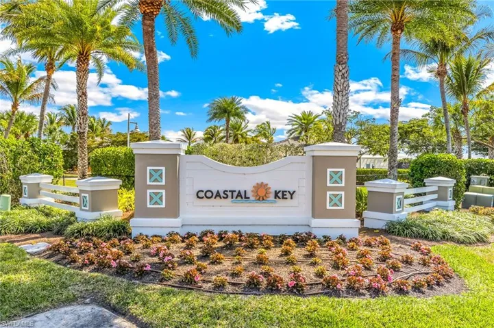 View of the front entrance to Coastal key and of the community sign.
