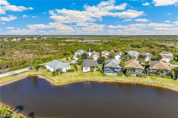 Aerial view of the rear of the home with an arrow to identify the subject property.