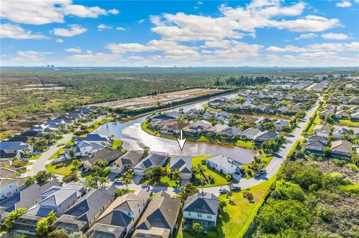 Aerial view of the community with an arrow to identify the subject property.