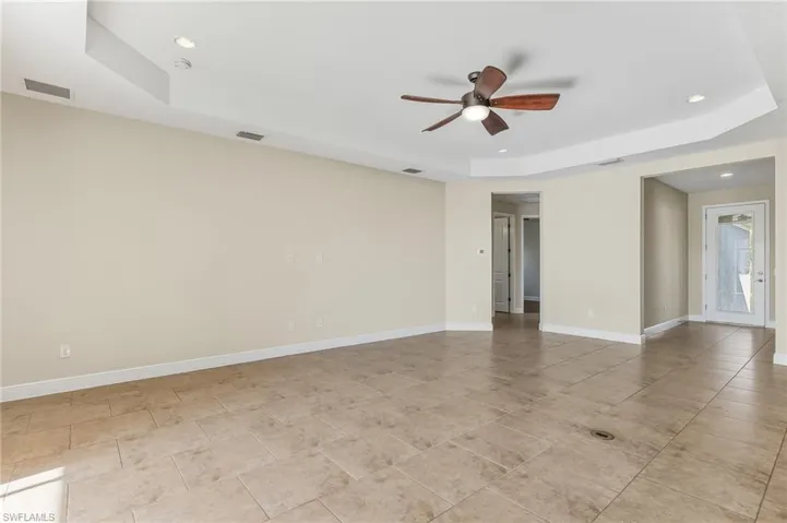 View of the living room area from the dining section of the home.