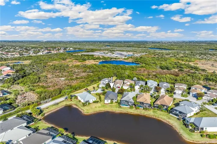 Aerial view of the community with an arrow to identify the subject property.