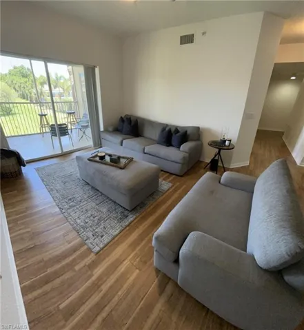 Living room featuring dark hardwood / wood-style floors