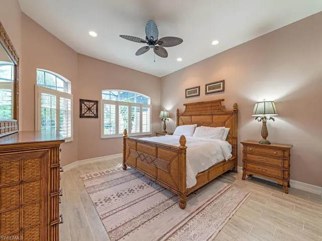 Bedroom with ceiling fan and light hardwood / wood-style floors