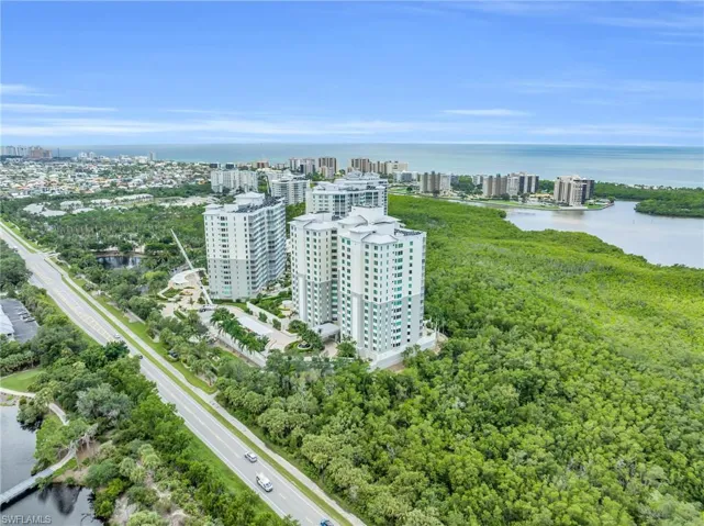 Birds eye view of property featuring a water view