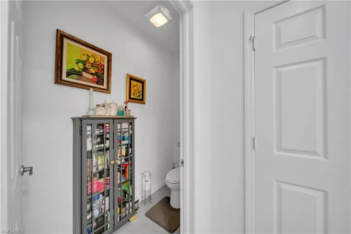 Bathroom with toilet and light tile patterned floors