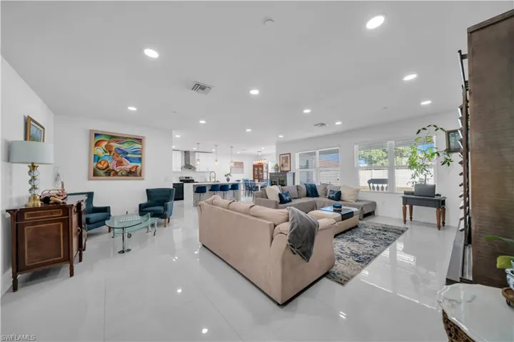 Living area featuring recessed lighting and light tile patterned floors