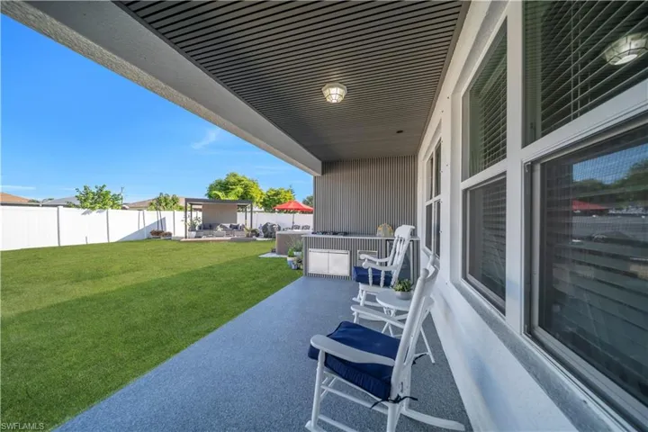 Fenced backyard featuring a patio and an outdoor living space