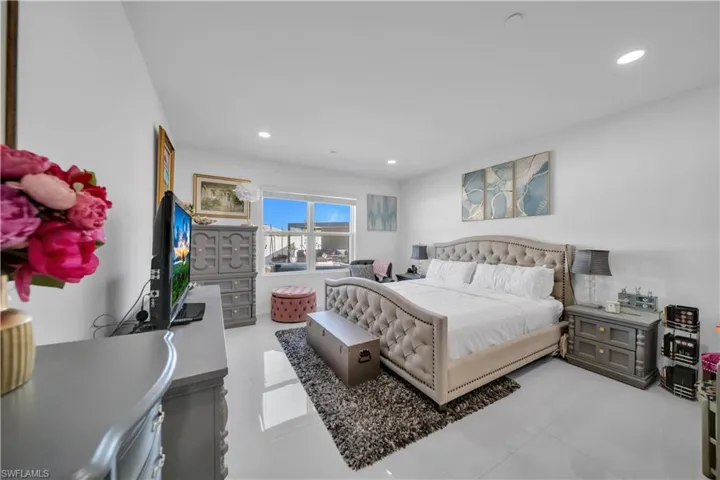 Bedroom featuring recessed lighting and light tile patterned flooring