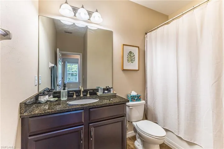 Full bathroom featuring vanity and toilet