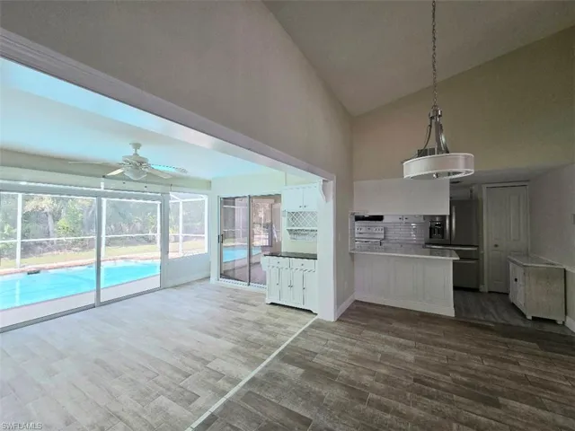 Great Room Transitions into Glass Enclosed Florida Room