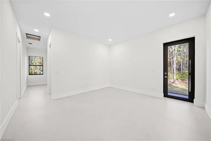 Unfurnished room featuring baseboards and recessed lighting