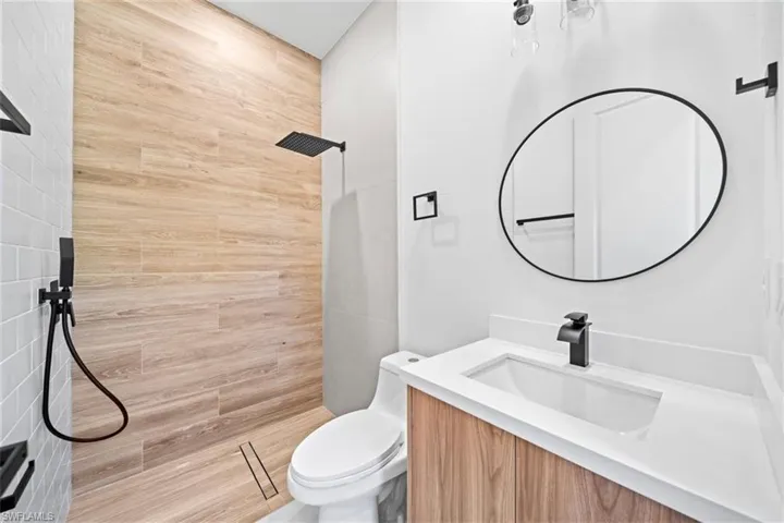 Bathroom featuring vanity and a tile shower