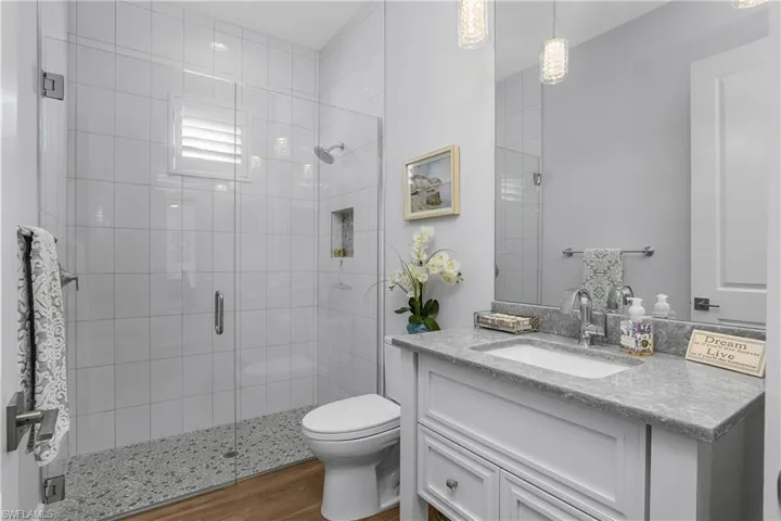 Guest bath also serves as pool bath and is located just off the bonus room and near the doorway to the lanai and pool.