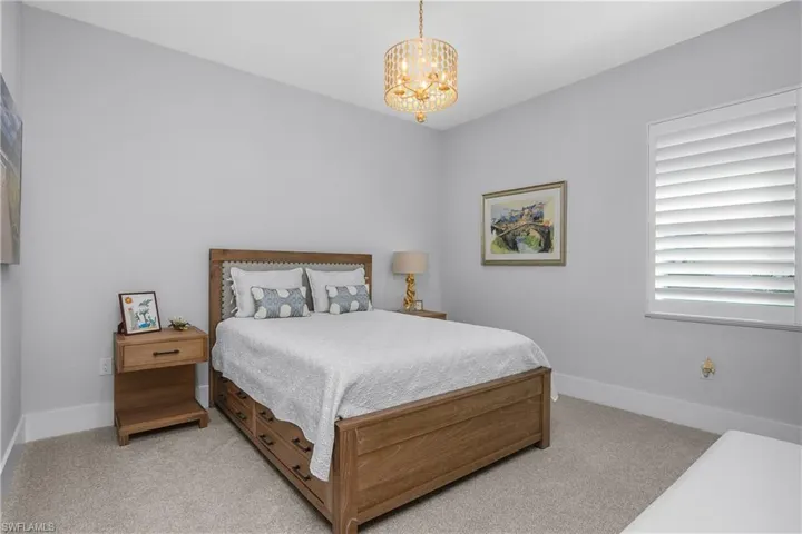 Guest bedroom includes a spacious closet and ensuite bath, making the space comfortable and private for guests.
