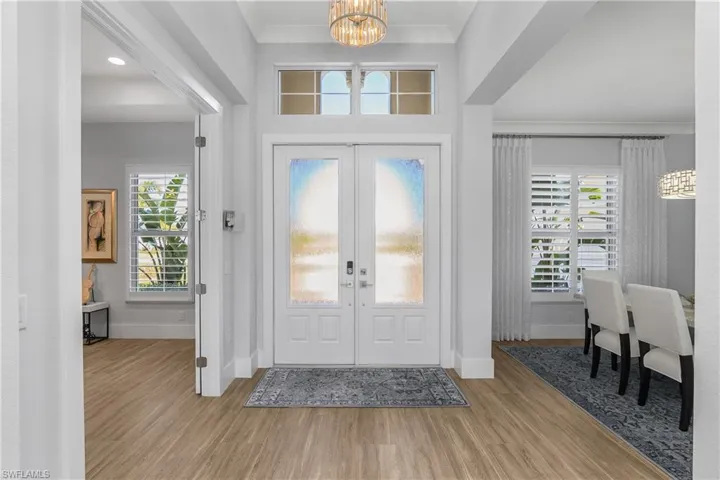 Welcome guests with double entry impact glass doors and an open floor plan, perfect for entertaining family and friends.