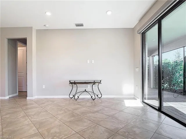 Unfurnished room with recessed lighting, visible vents, and baseboards