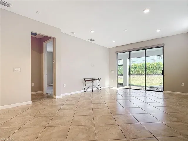 Spare room featuring recessed lighting, light tile patterned floors, baseboards, and visible vents