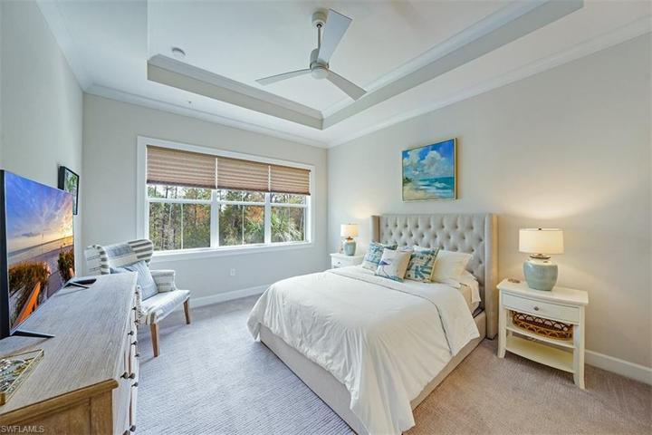 Enjoy watching sunrises over the nature preserve from the spacious master bedroom with tray ceilings.