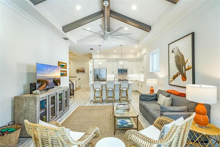 The spacious and open great room features vaulted and beamed ceilings.