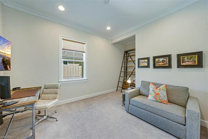 The den/study, which can easily be converted into a third bedroom, is directly across from the third bathroom. French doors provide privacy.