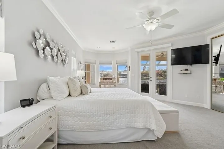 Bedroom with access to outside, carpet floors, french doors, crown molding, and baseboards