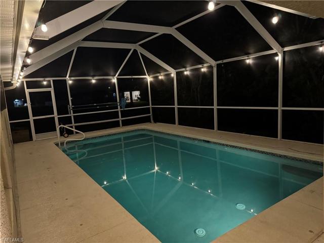 Pool with lights at night.