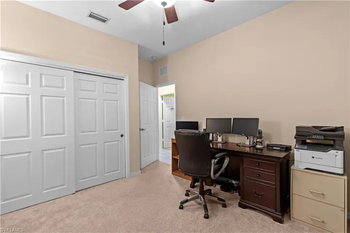 Fourth bedroom featuring light colored carpet