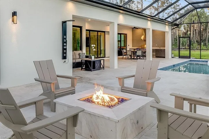 Large entertaining space including a saltwater pool, gas fire pit, outdoor shower and an outdoor kitchen