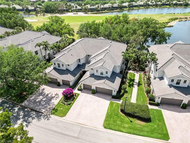 Drone / aerial view featuring a water view and view of golf course