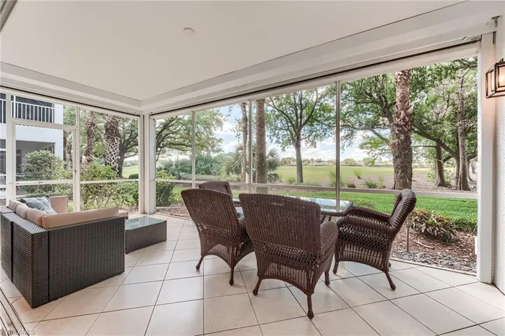 Sunroom / solarium featuring a healthy amount of sunlight and an outdoor living space