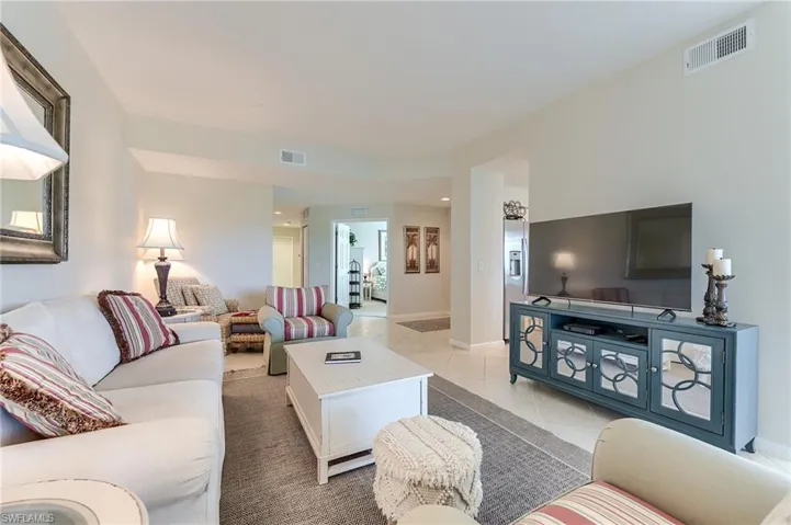 Living room with  light tile patterned floors