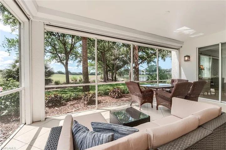 Sunroom / solarium with an outdoor hangout area and outdoor dining space